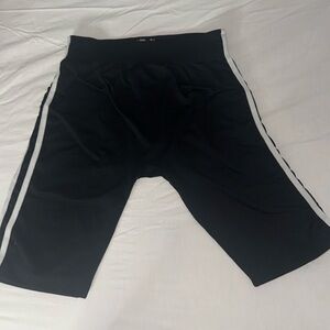Long Black and white striped spandex shorts 
Medium/Large 
Stretchy waist band